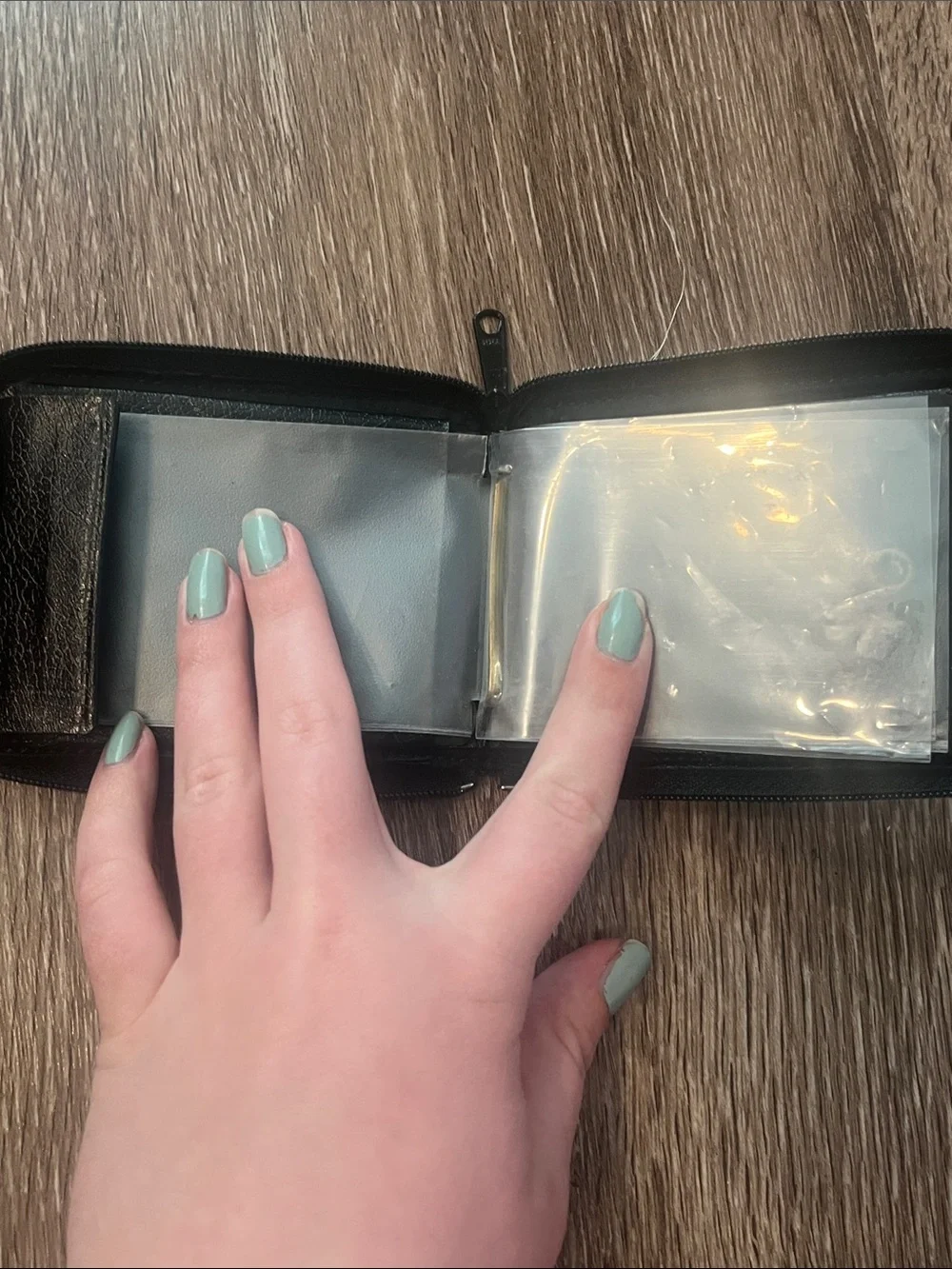 split Black Leather Zip-Around Wallet with Gold Accents